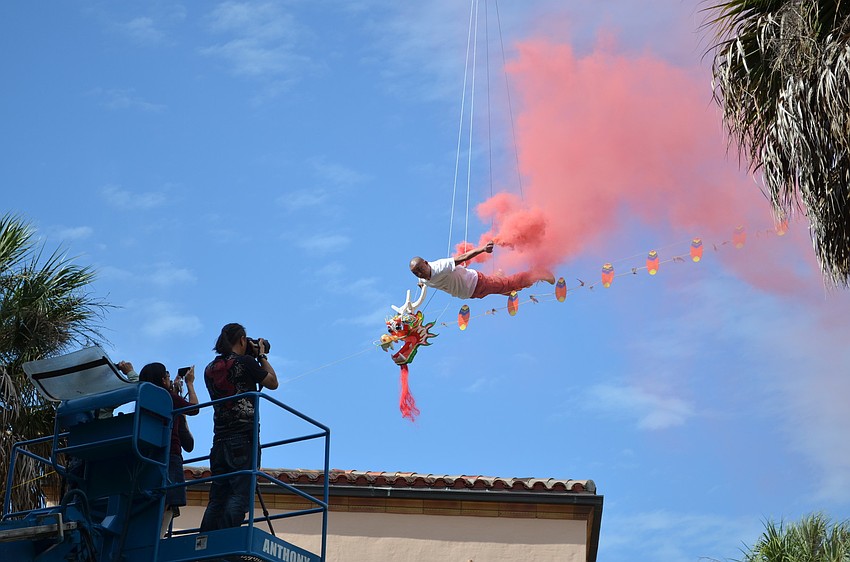 Li Wei opens up his trademark smoke canisters to add a billowing affect of color and wind.