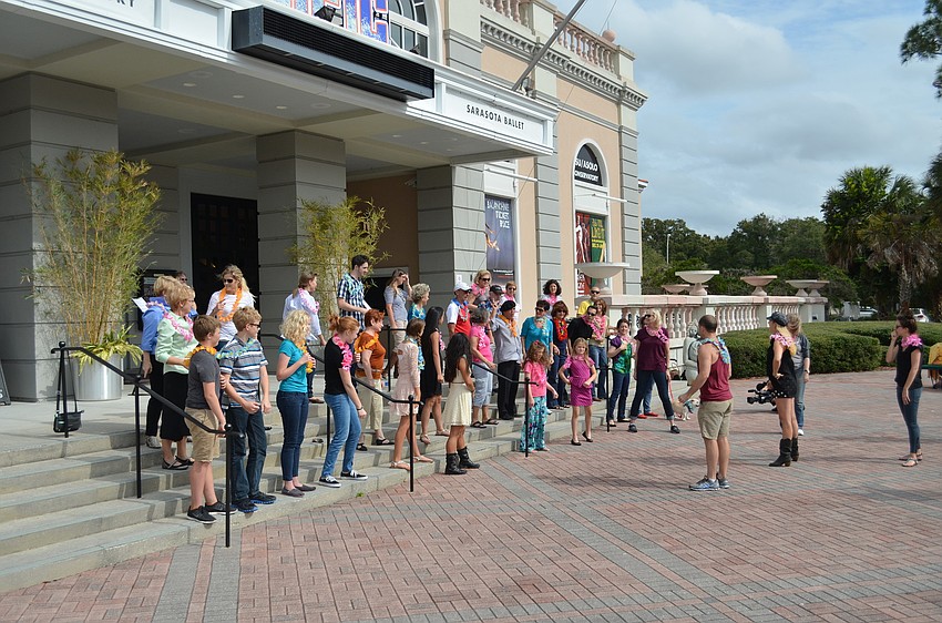 A break during rehearsal and reviewing the dance moves