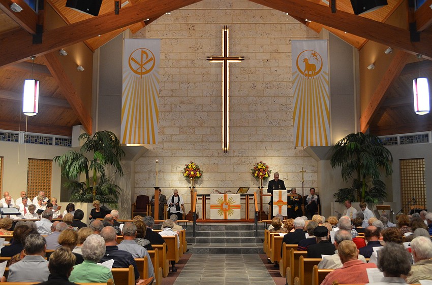 The Rev. Vincent Carroll, of Longboat Island Chapel, gives the Presidential Proclamation.