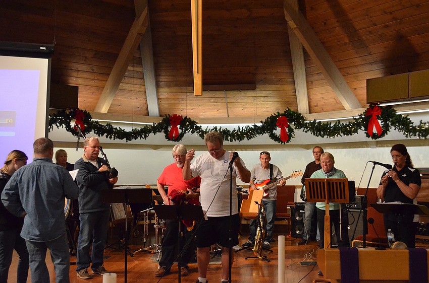 Gary Reinstrom, pipe major and artistic director, leads the Jacobites Pipe & Drum Band through a tough section of a Scottish ballad.