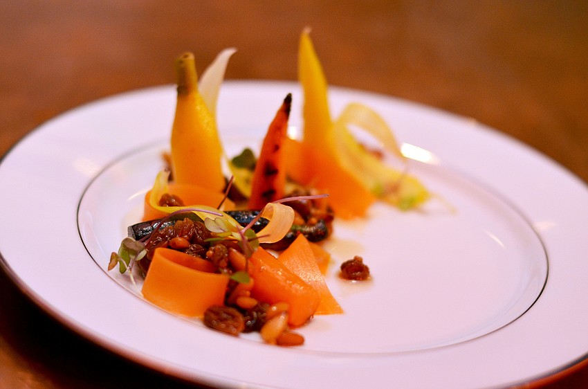 Chef Paul Anders, from Sweet Basil and Mountain Standard in Vail, Colorado, preparers the first course: Carrot Variations, with Ricotta and Smoked Trout Roe