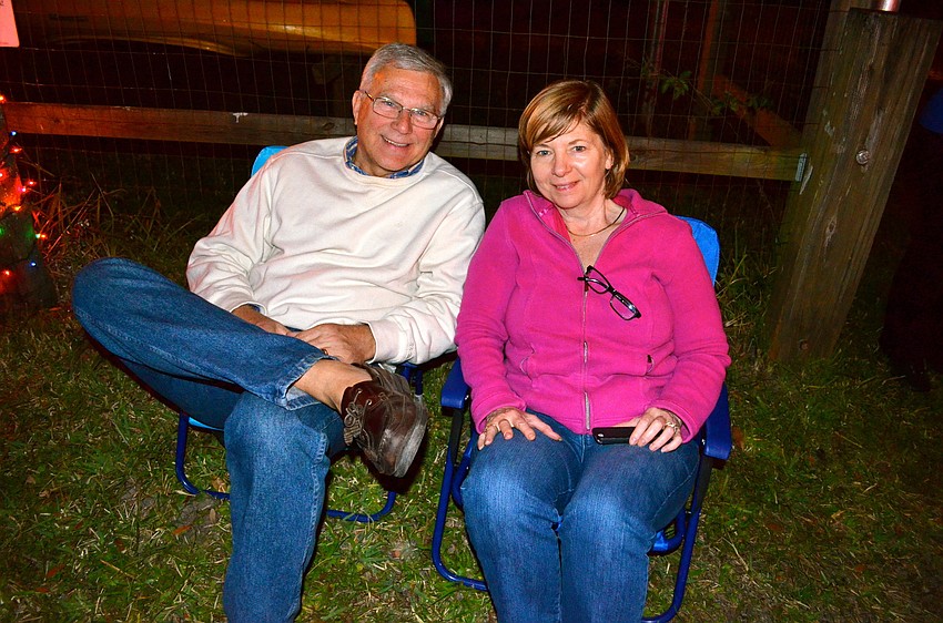 Ed and Carole Bernard snuggle up on the sidelines to watch the parade.