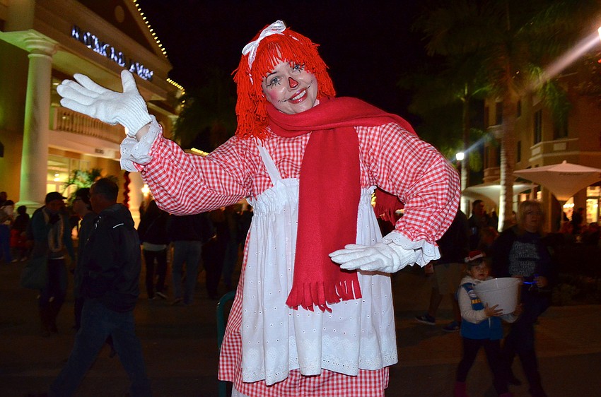 Fran Goh poses as Raggedy Ann for passersby.