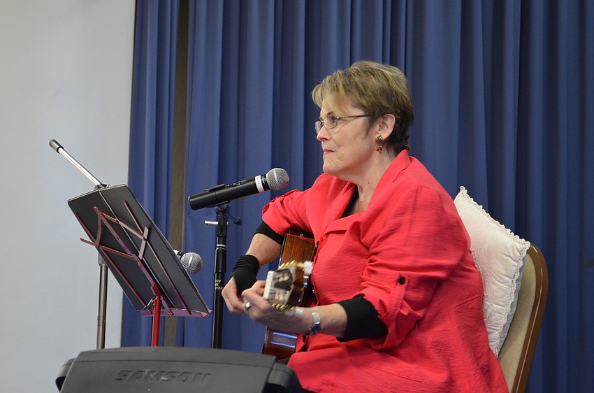 Rosalie Leon leads the group in singing Hanukkah songs like â€œLight on Candleâ€ and â€œLatke Rock.â€