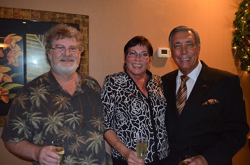 Stephen and Karyn Powell, of Jewelry by Cole, and Andrew Vac, of RE/MAX