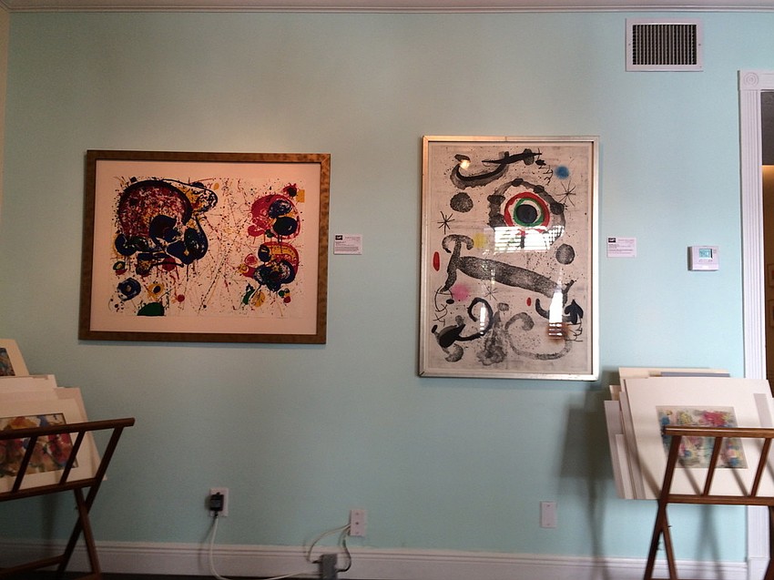 Two prints on display by Sam France and Juan Moro, respectively.