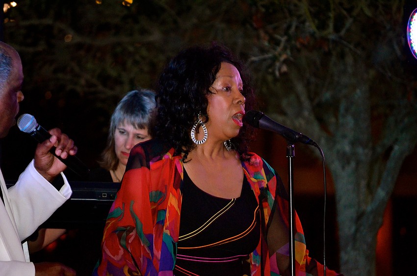 Katt Heffner sings for her audience.