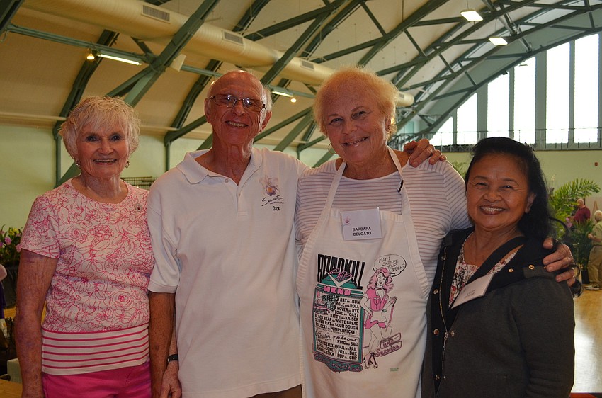 Sarasota Orchid Society Members Karen Knuese, Jack Knuese, Barbara Delgato and Lory Boyce volunteer for the show.