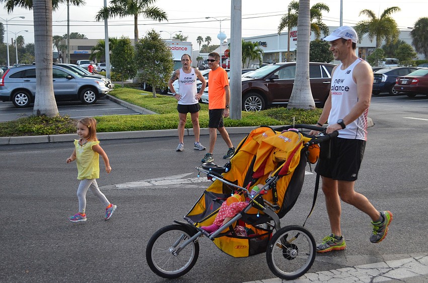 Jessie Ochsendorf approaches the finish line with her father Dave.