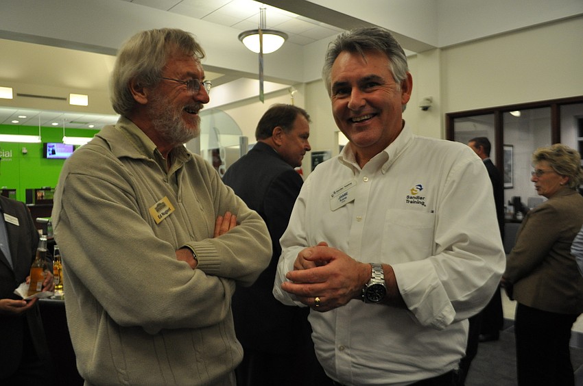Ed Nugent, of Cornerstone Signs and Graphics, networks with Jamie King, of Sandler Training.