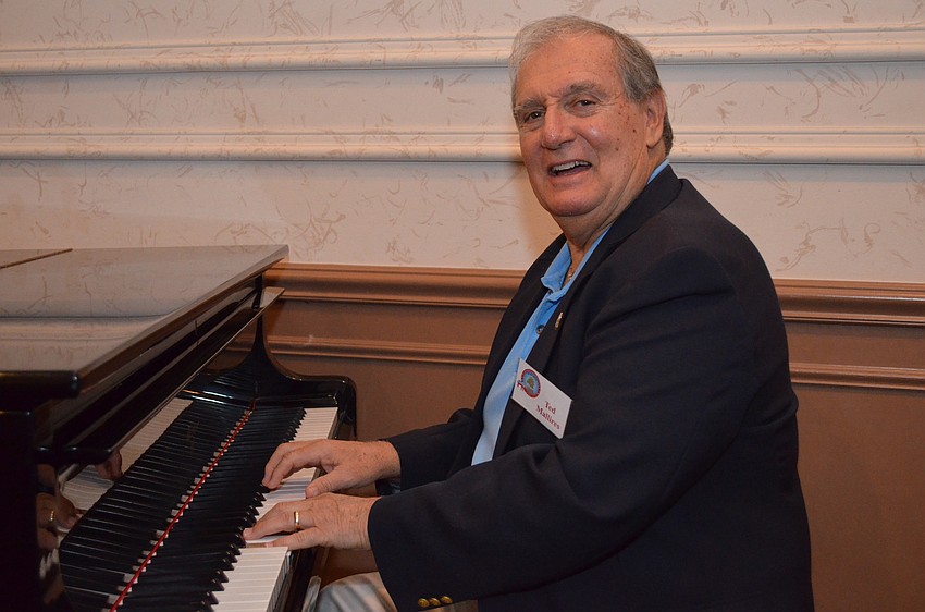 Member Ted Mallires spotted the piano and decided to entertain guests.