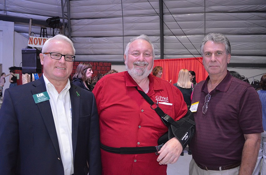 John Wojtyna, of Plumbing and Air Quality Service, and Jack Dean and Joel Trippiedi, of G. Fried Flooring