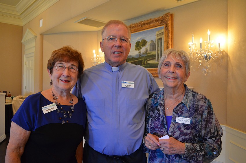 Ramona McGee, Pastor Don Henry and Joan Scheller.