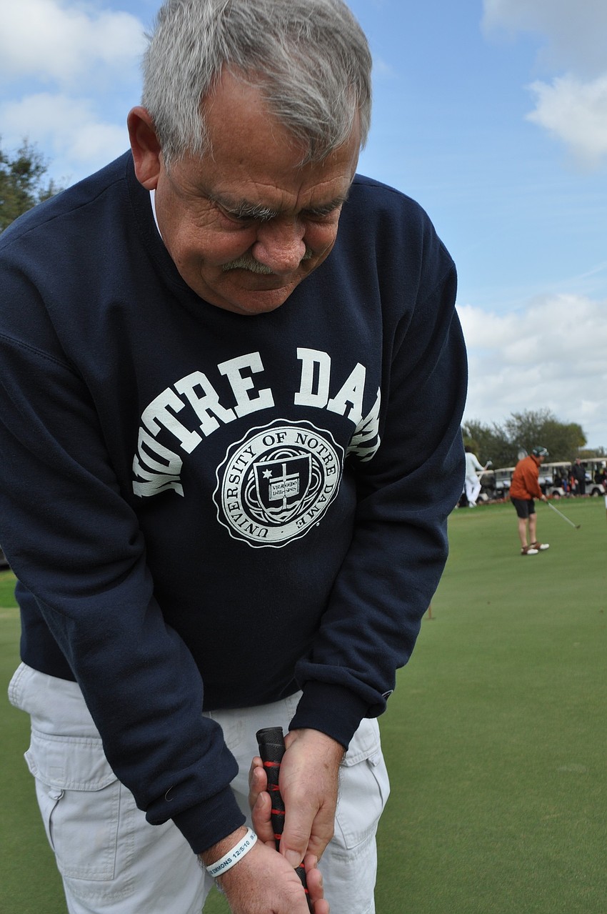 Jerry Fish practices hi putt.
