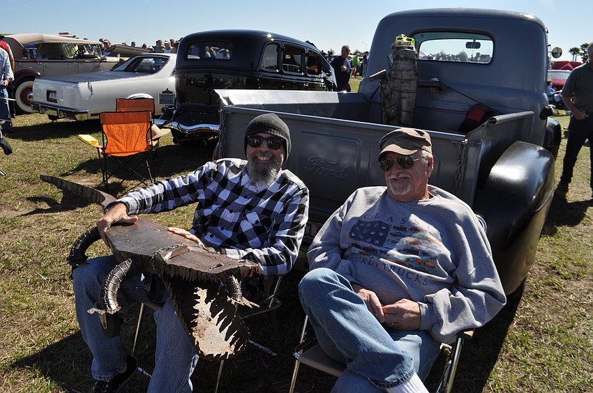 Mark Wood hangs out with Phil Wade, who shows off his Ford pickup.