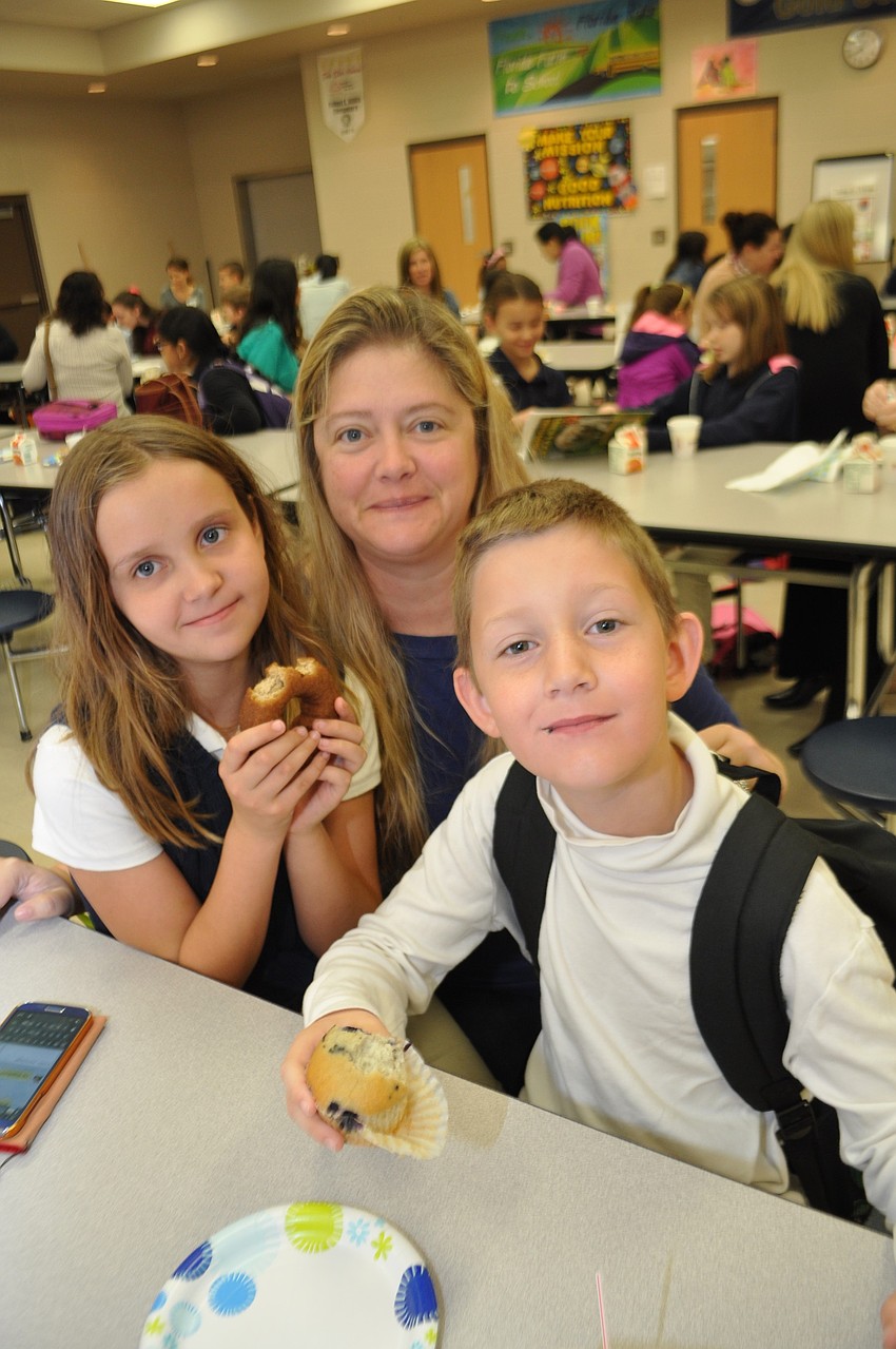 Lesa Miller, center, joins her children, Faith and Chance.