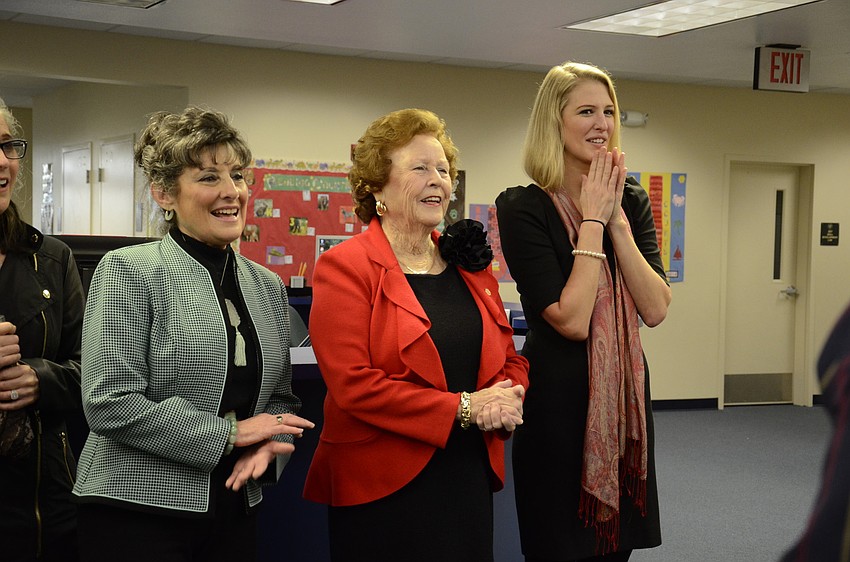 Education Foundation members Dorothy Stuart, a selection committee member, and Shirley Ritchey, founder, and School Board member Bridget Ziegler clap for the Edward Hashley.