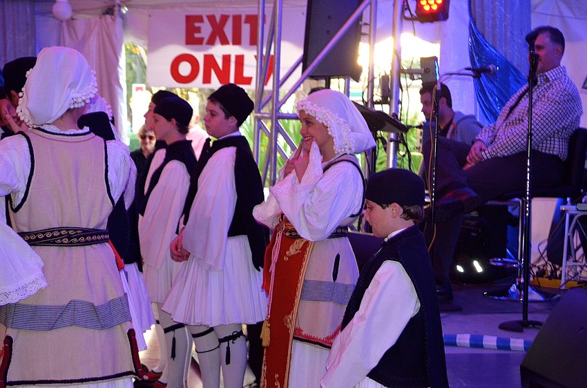 Stella Geis encourages another dancer to smile for the audience.