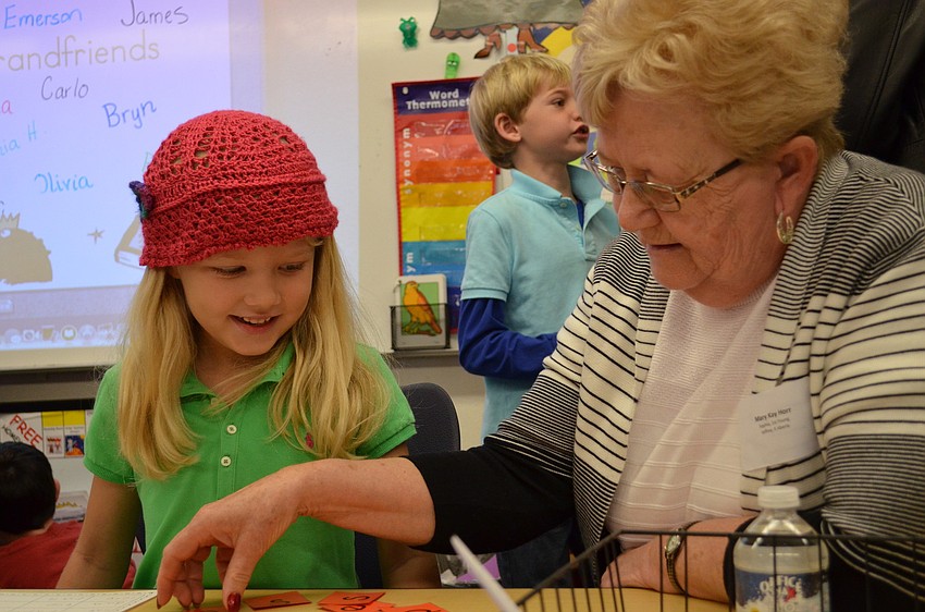 Sophia Horr and her grandmother Mary Kay Horr work together on an activity during Grandfriends' day.