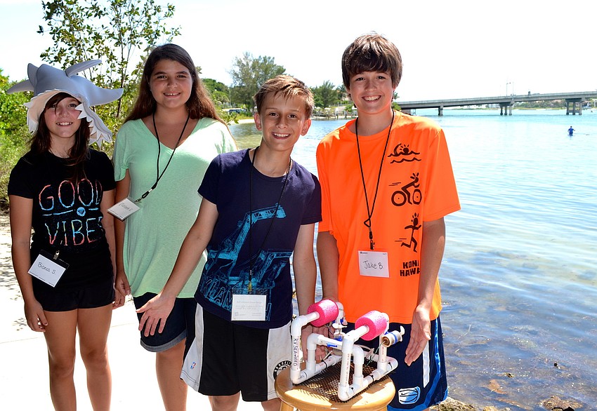Bianca Shriver, Elizabeth Englander, Elliot Radin and Jake Barrett pose with RV Seaweed.