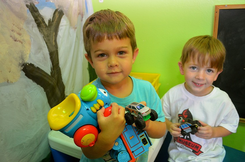 Logan Jacobs and Beckett Farmer enjoy play time.