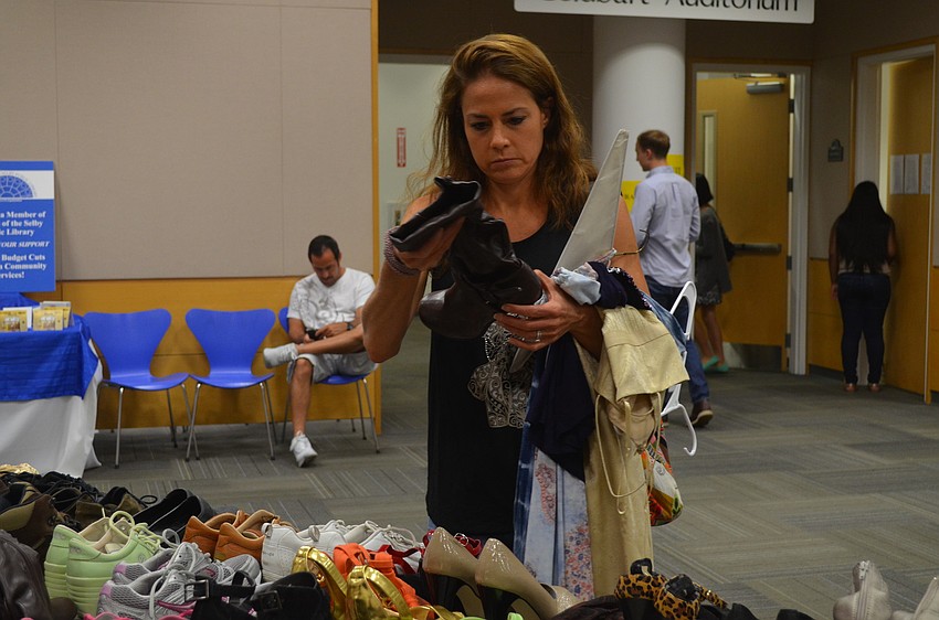Christie Harping looks at shoes.