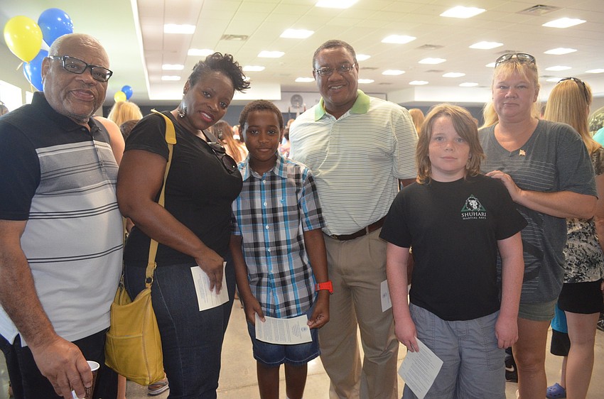 Frank, Lâ€™tea Myles and Frank Woodward Jr. with Jaden and Carla Howes