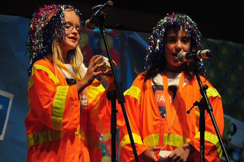 Charley Hunn and Briana Barbosa act as robots programmed to find all their answers in the Bible.