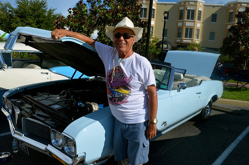 Rod Dimond is all smiles next to his 1970 Oldsmobile Cutlass SX.