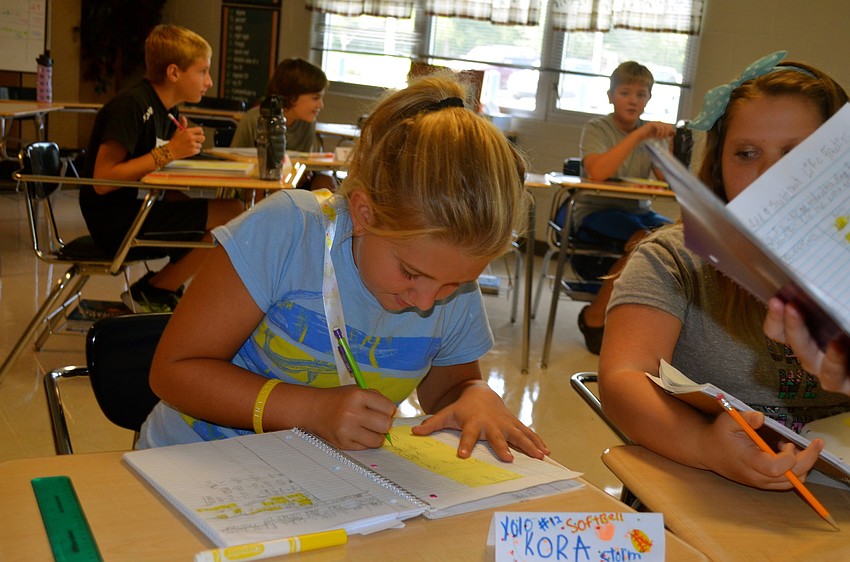 Kora Turner concentrates on solving a math problem.