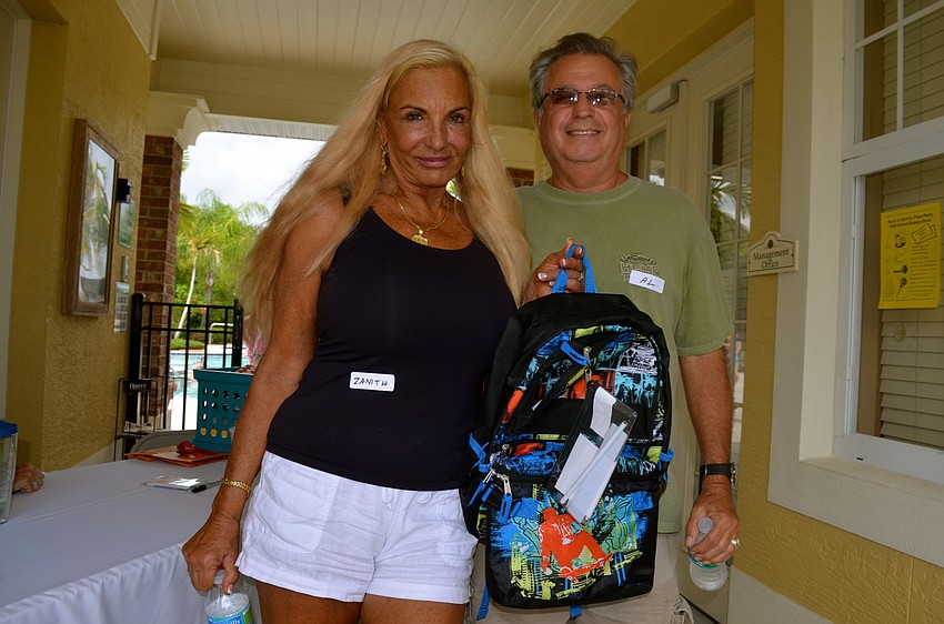 Zanith Brunda and Al Hamel donate school supplies at the inaugural event.