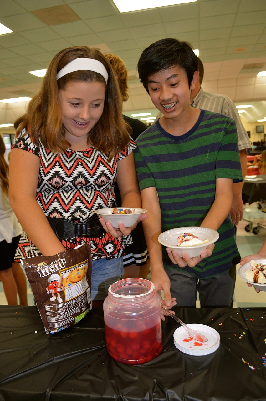 Ashley Danko and Charles Hang pick out toppings for their ice cream.
