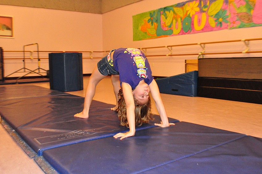 Marianne Schwartz tumbles for fellow campers.