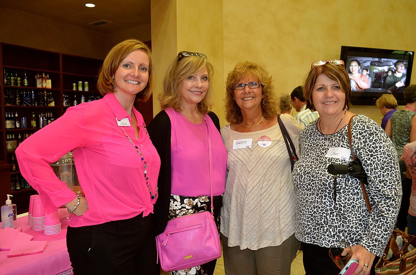 Robyn Faucy, Cindy Corbin, Sharon Carlson and Jan Chulock socialize while eating.