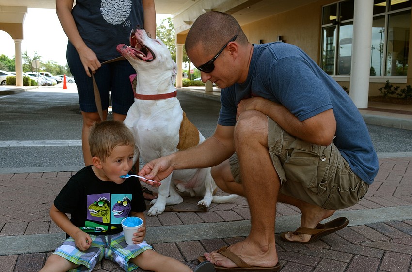 Bryce and Ryan Harvey snack on cold treats.
