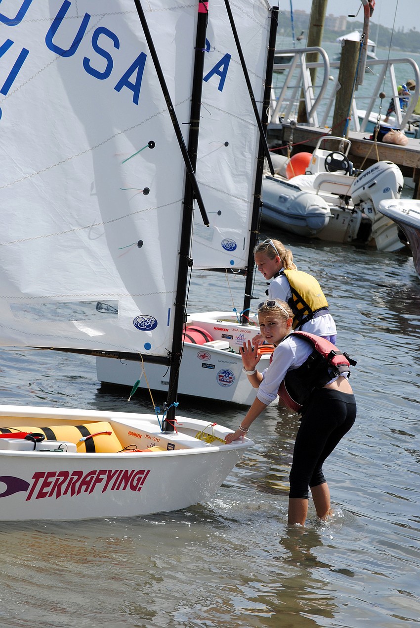 Terra Ehrhart waves to her mom as she gets ready to set sail in her boat â€˜Terrafyingâ€™