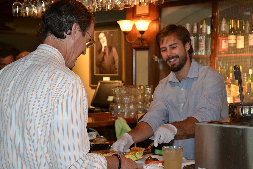 Joe Frayer serves Terry McGannon.