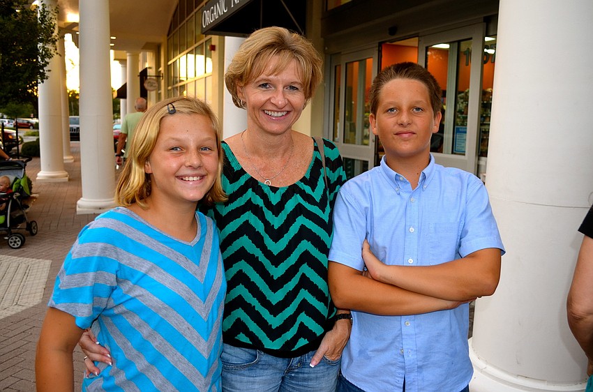 The Sidlo family â€” Madi, Mirka and Matthew â€” enjoy the music and food.