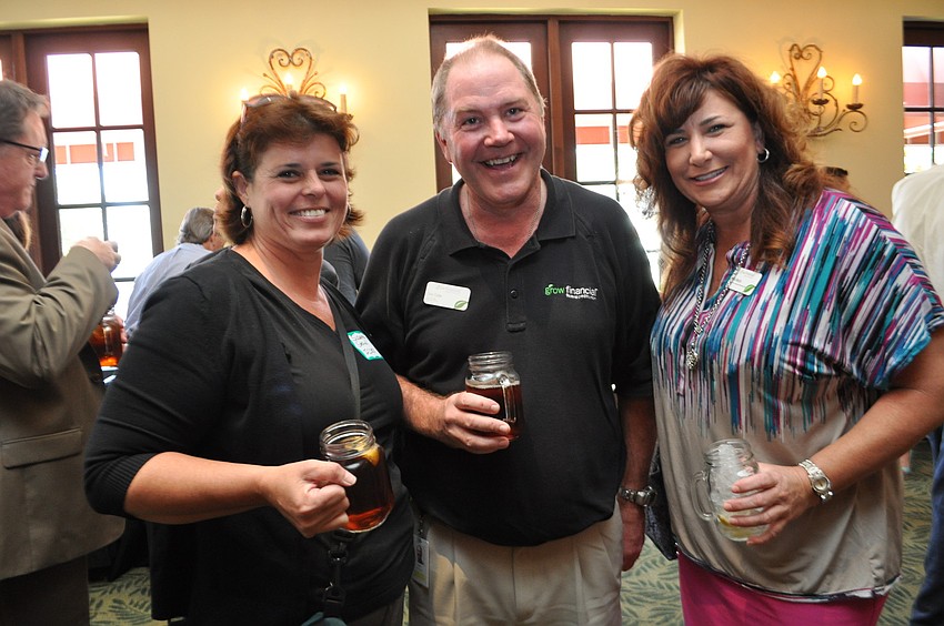 Susanne Stovall, of ICORR, with Tom Cofer and Lana Walsh, both of Grow Financial