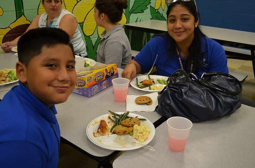 Mario and Adela Martinez planned on paying Family Fued following dinner at the Family Fun Night.