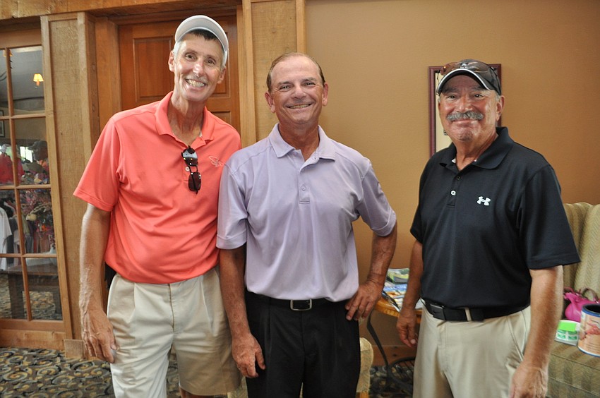 Craig DelFabro, Steve Lux and Dave Kahn prepare for lunch.