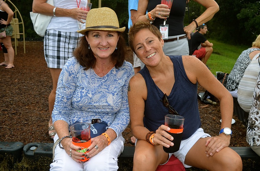 Valerie Grinols and Teri Rivera enjoy the musical entertainment.