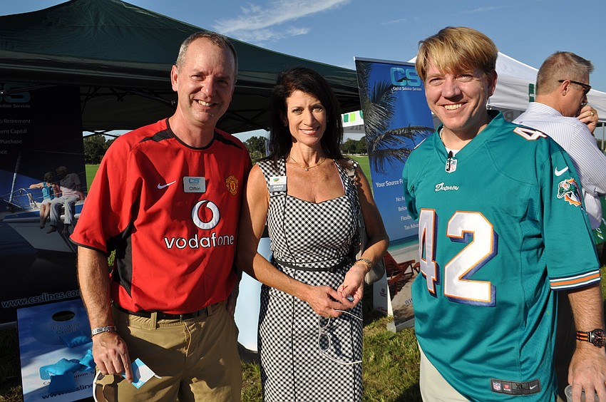 Clifton Aiken, of Capital Solution Services, joined Jennie Lucier, of Alltrust, and co-worker Michael Williams, also of Capital Solution Services.