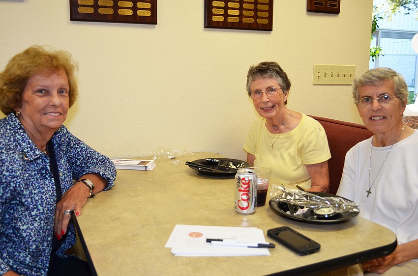 Dan and Kathi Jones toast fried shrimp with Garry Deboer.