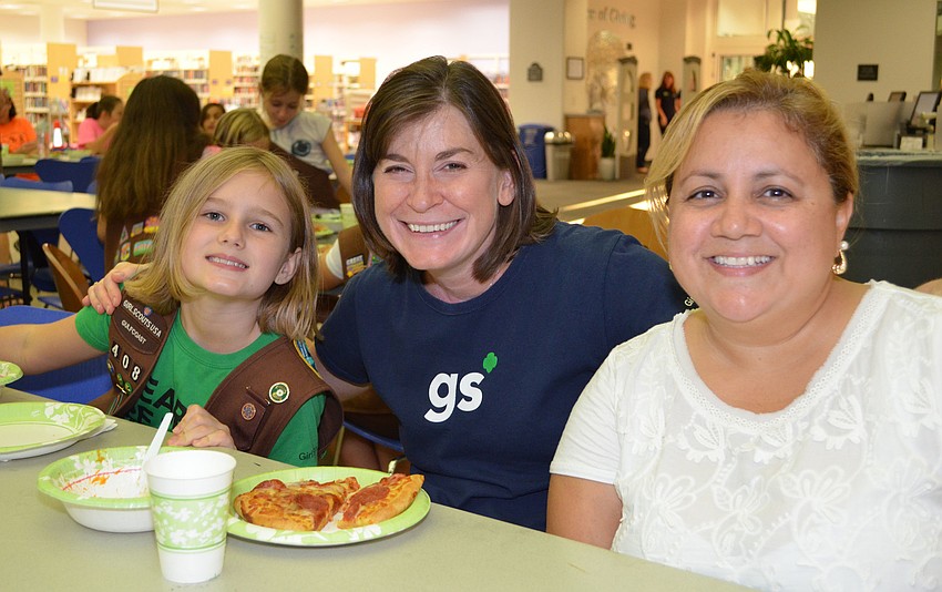 Olivia Szymanski, Amy Arrigo and Denise Sarjeant enjoy dinner at the Scout About the Library event.