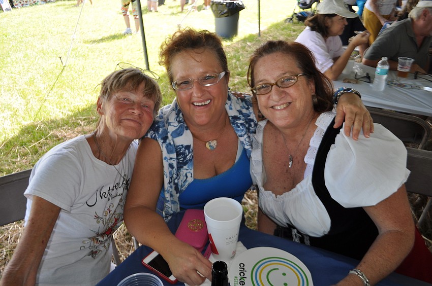 Diana Berry, Jacki Roy and Mona Gallo listen to music.
