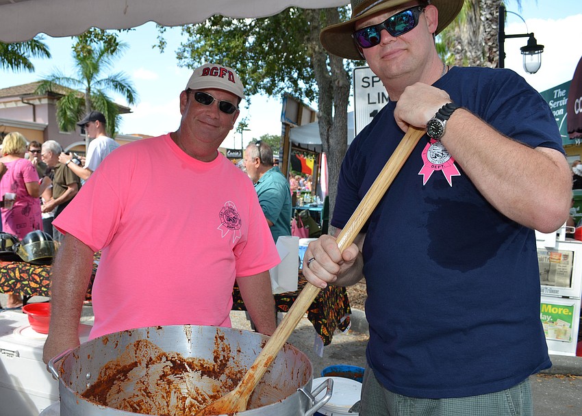 Wayne Griffith and Damon Williams keep the chili stewing for the Boca Grande Fire Department.