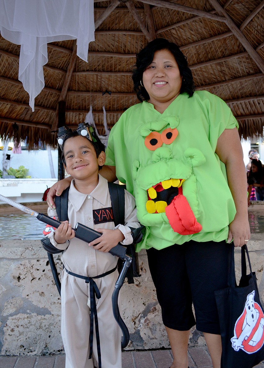 Erika and her son Eliberto dressed as Slimer and a Ghostbuster