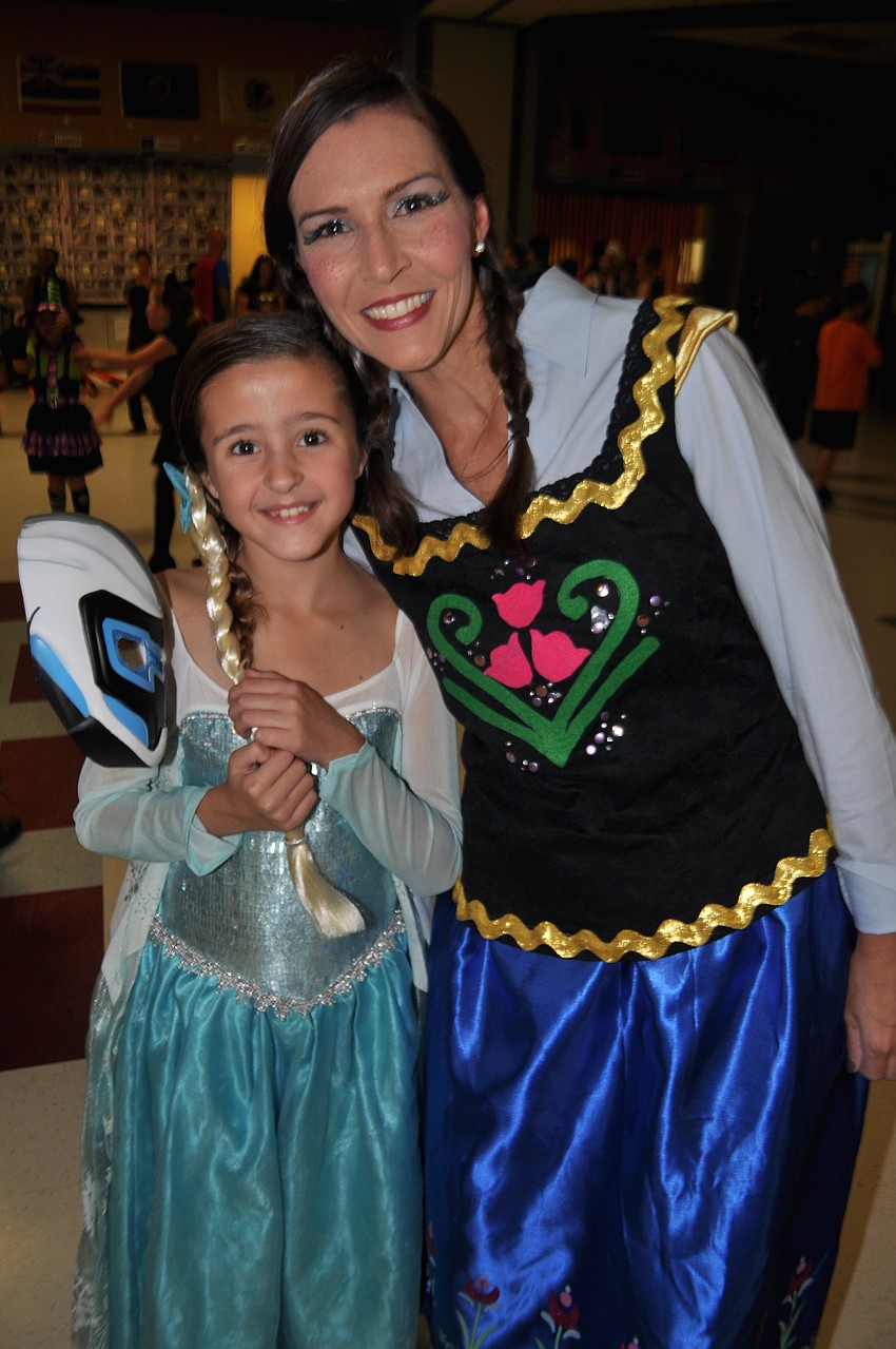 Sophia Mandine, as Elsa, poses with Assistant Principal Laura Campbell.