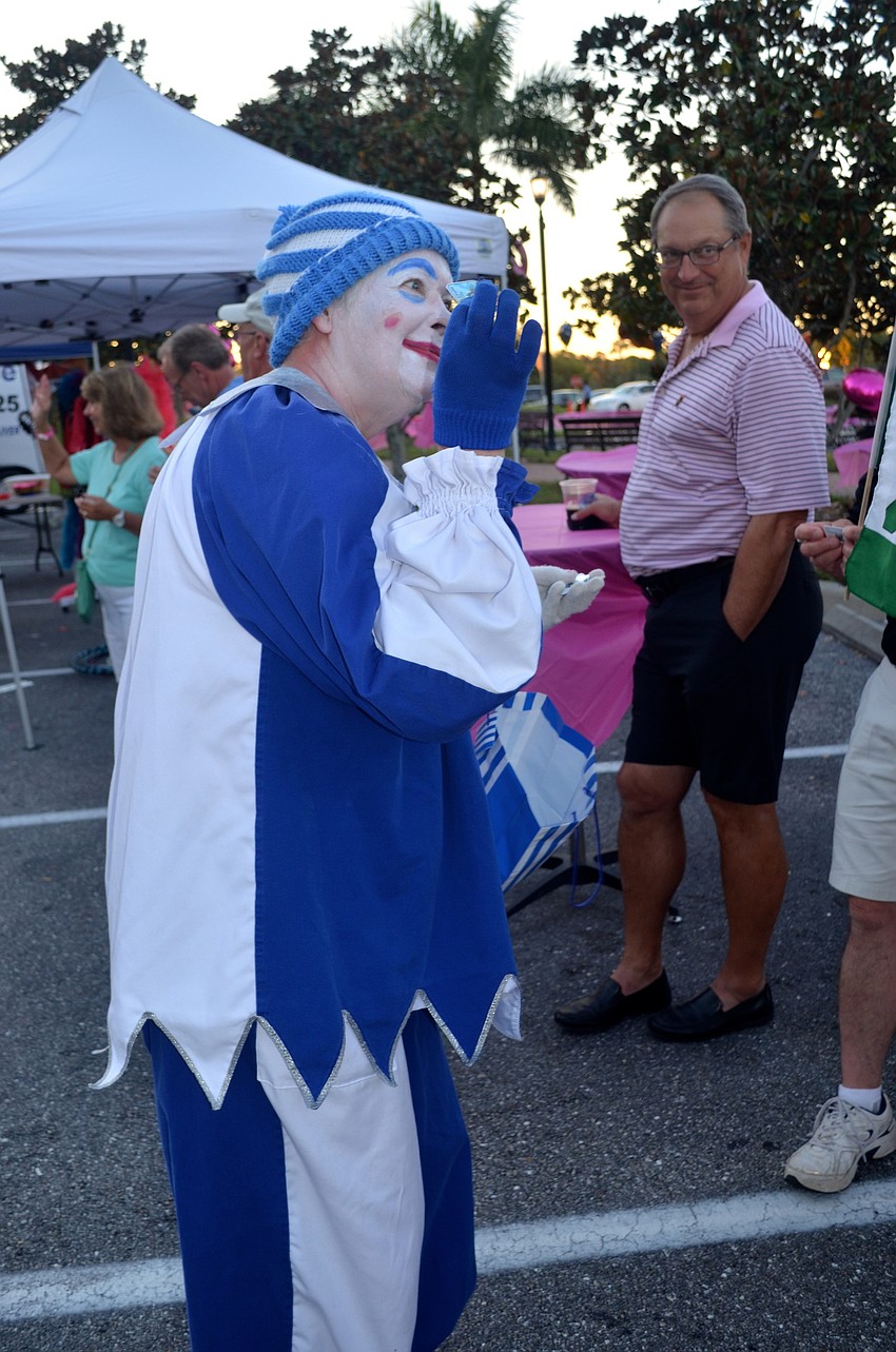 Eileen Gilbert hands candy to parade spectators.